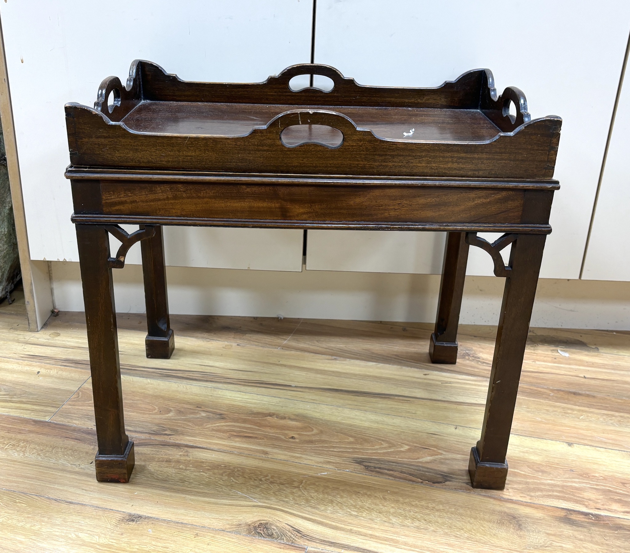 A George III style rectangular mahogany butler’s tray on stand, width 56cm, depth 39cm, height 51cm